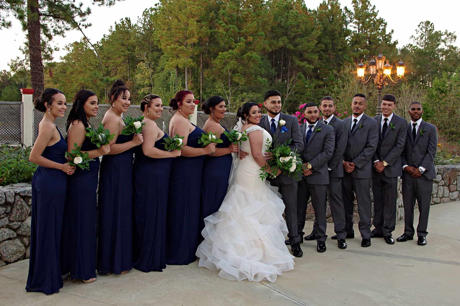 A group of people in suits and dresses