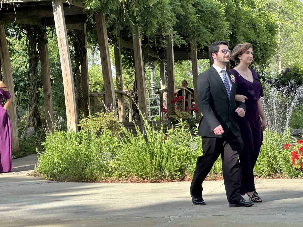 Couple under the garden pergola at Mariani's Venue