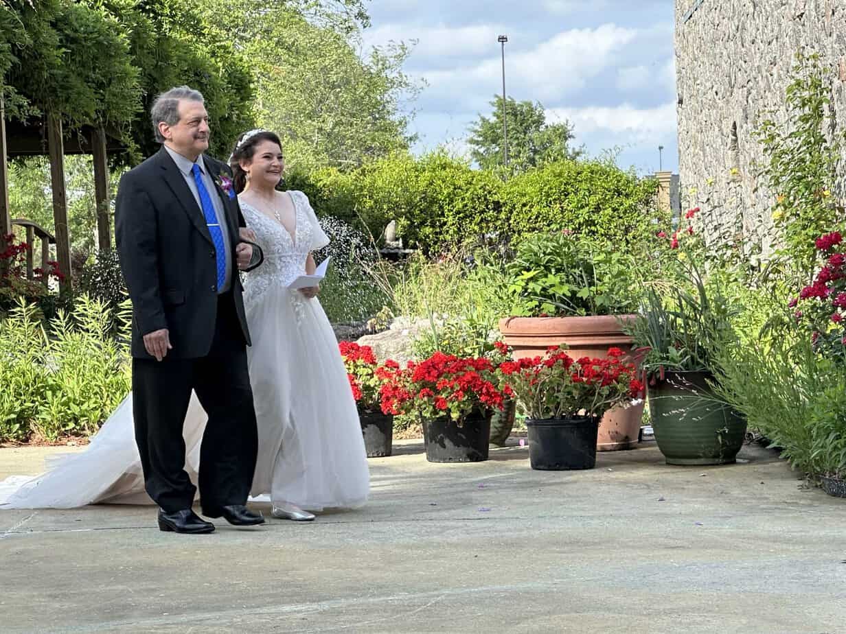 Bride and groom in the rose garden at Mariani's Venue