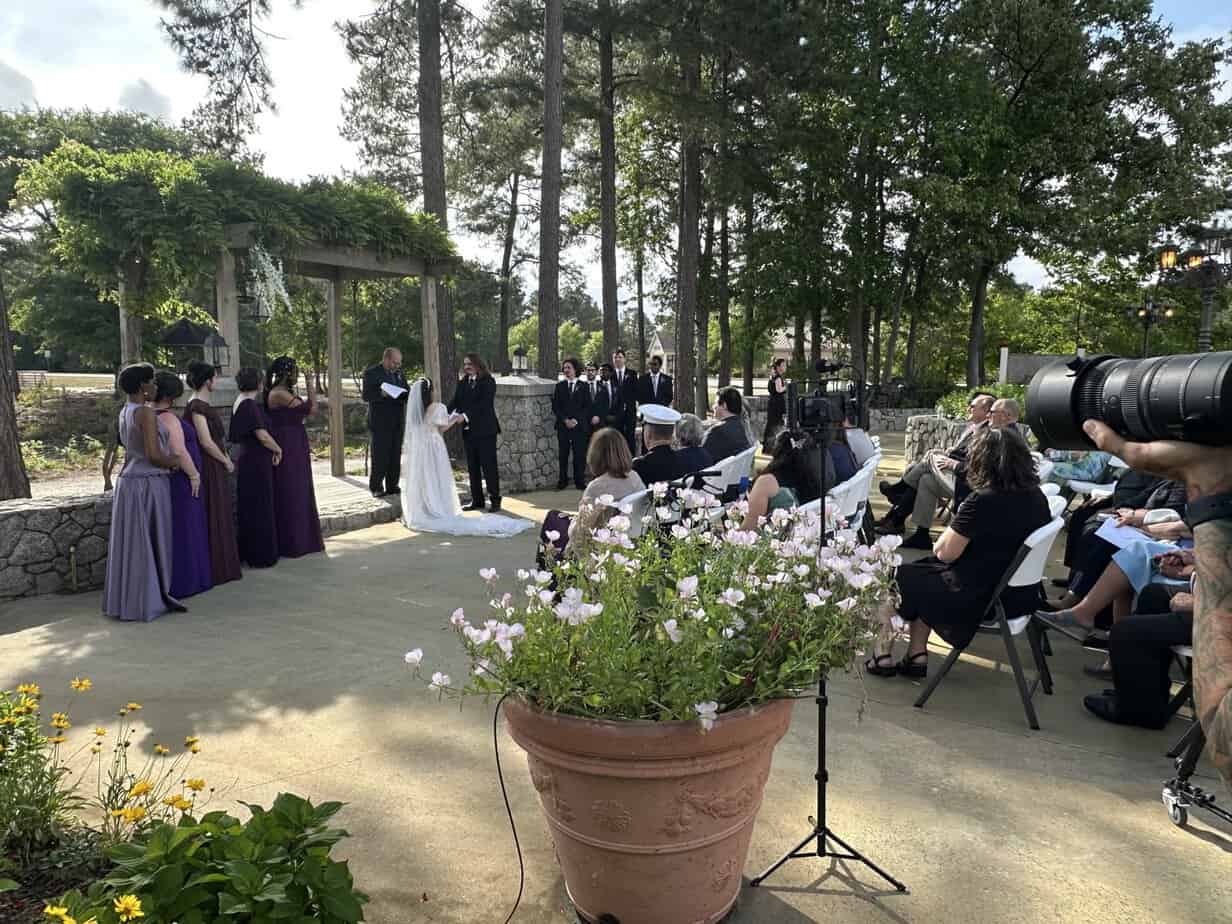 Outdoor wedding ceremony under the arbor at Mariani's Venue near Fayetteville, NC