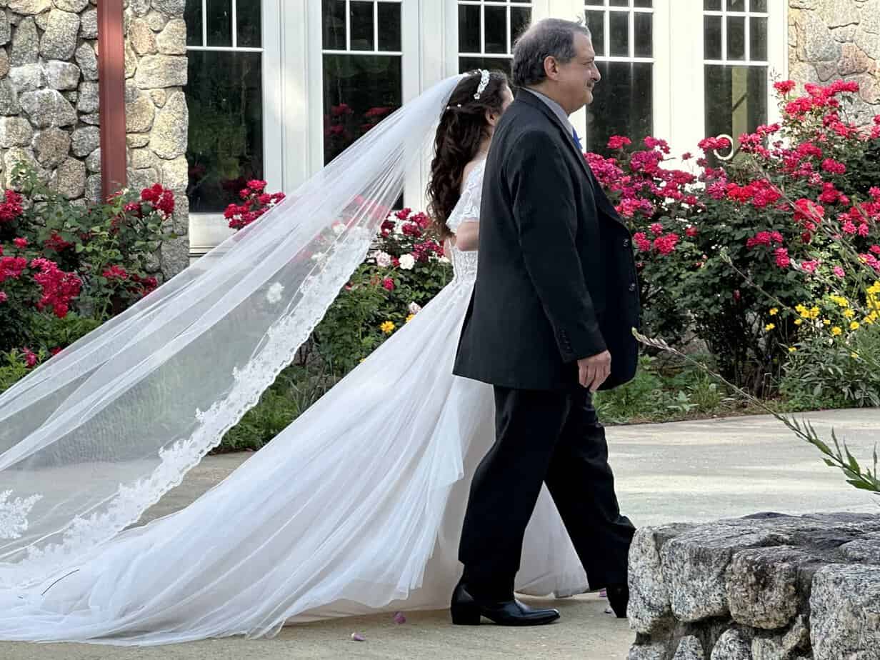 Bride walking with her father at Mariani's Venue near Fayetteville, NC