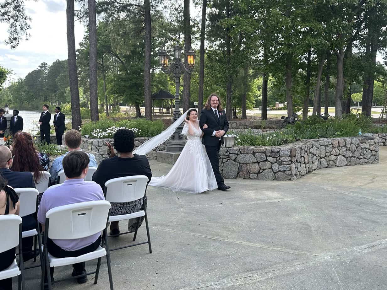 Newly married couple walking down the aisle at Mariani's Venue near Fayetteville, NC