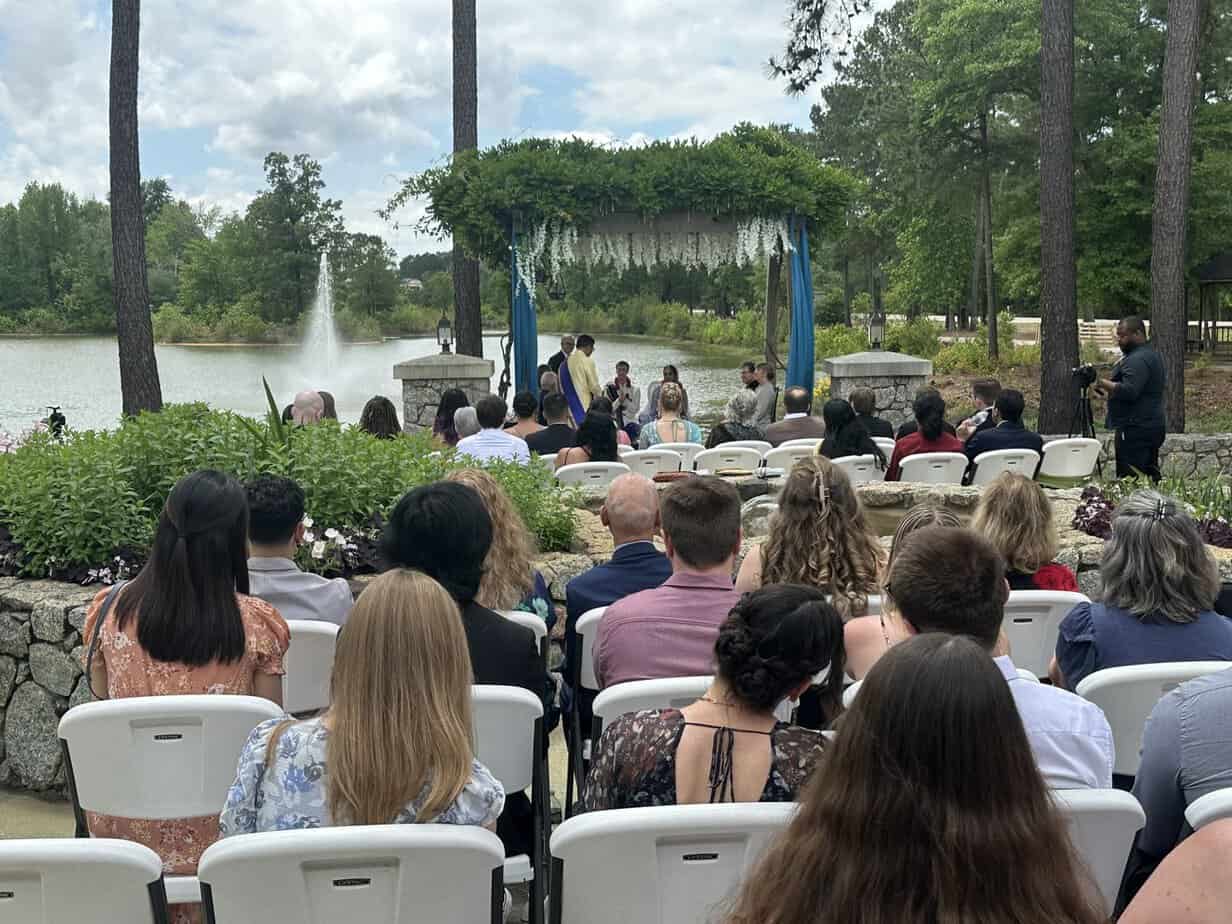 Wedding ceremony by the lake fountain at Mariani's Venue near Florence, SC