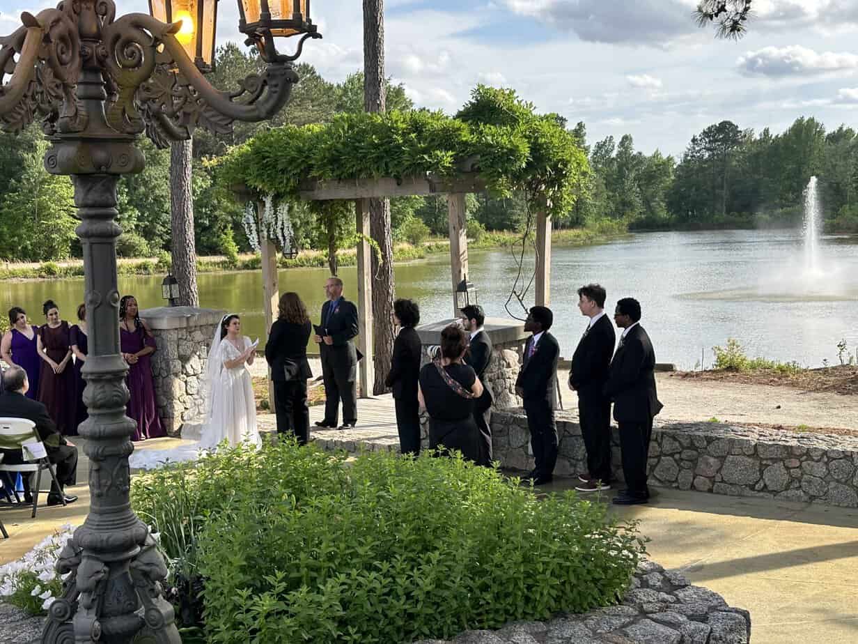 Wedding ceremony under the garden arbor at Mariani's Venue near Raleigh, NC