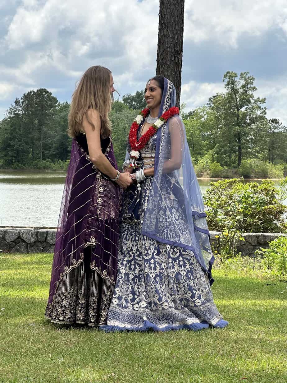 Bride in traditional dress by the lake at Mariani's Venue near Raleigh, NC
