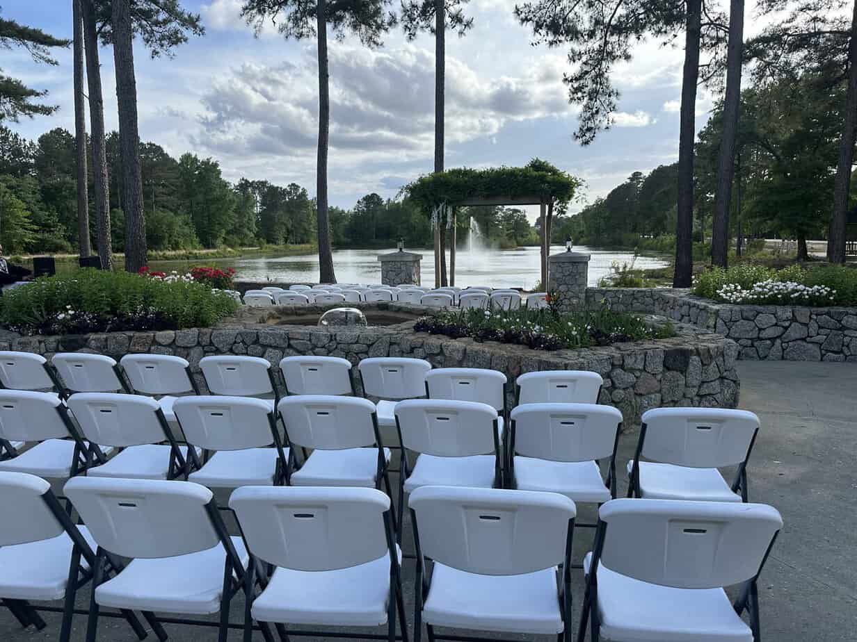 Outdoor ceremony setup by the lake at Mariani's Venue near Raleigh, NC